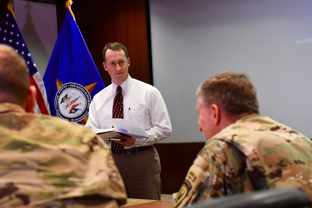 Mr. John Fay, chief of EUCOM's Information Superiority and Knowledge Management Division, presents his submission to Lt. Gen. William B. Garrett III, Deputy Commander of U.S. European Command during the first EUCOM Rapid Innovation Cell forum held Feb. 2, 2016. Macpherson has been assigned to EUCOM for nearly three years and works various posture related issues for the command. (U.S. European Command Photo by Master Sgt. Charles Larkin Sr./Released)